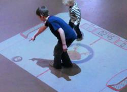 PO-MOtion interactive air hockey floor projection for Zunum Restaurant